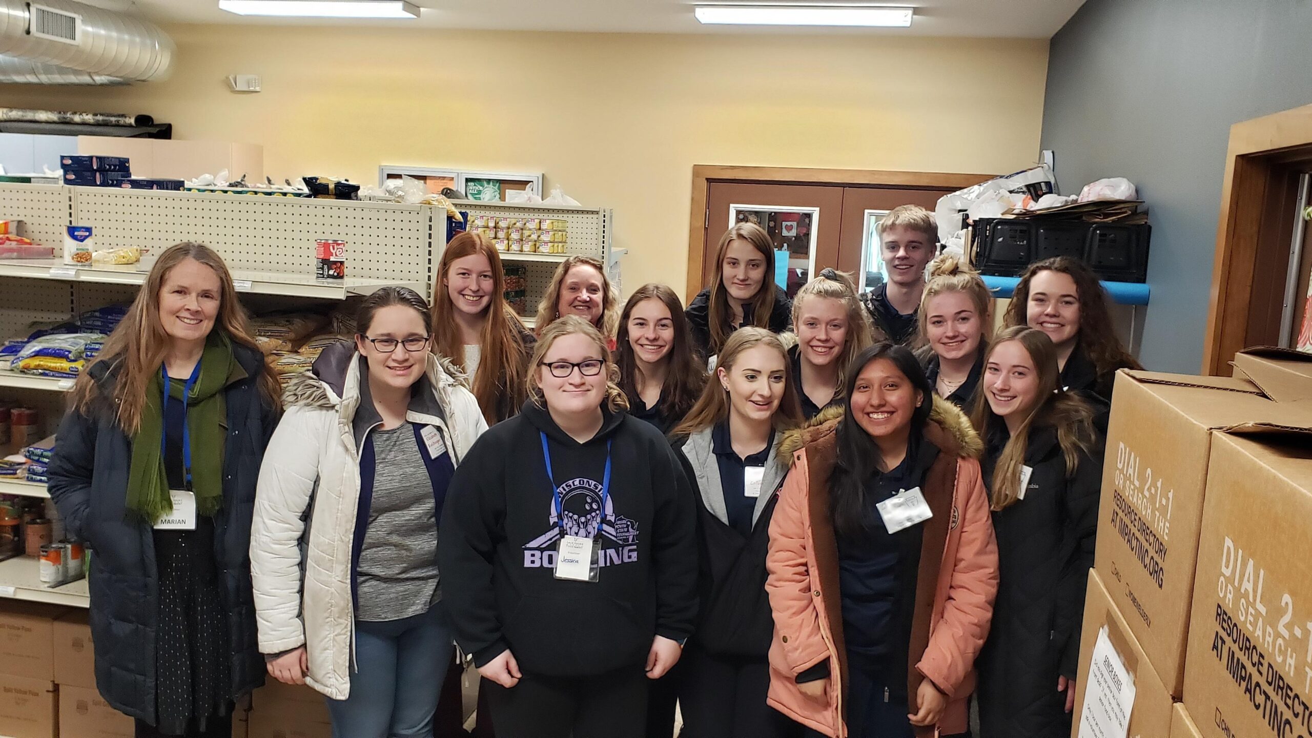 A group of teenagers volunteer at the Sauk Prairie Food Pantry.